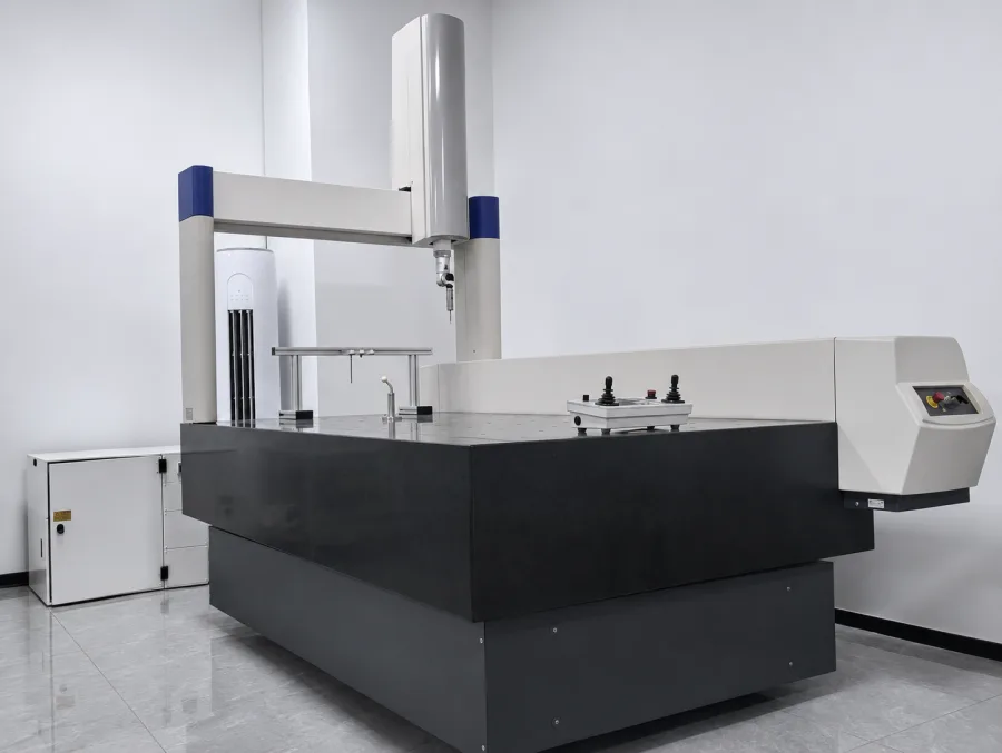 Coordinate measuring machine checking a machined test piece in the inspection room